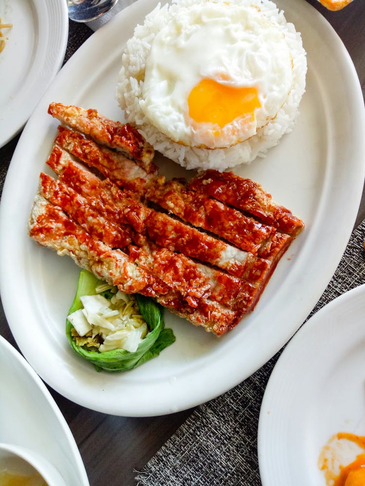 Fried Pork Slices And Egg For Breakfast