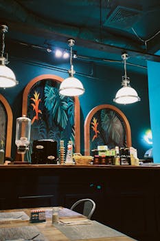 Inviting café interior in Oran, Algeria with modern decor and vibrant lighting.