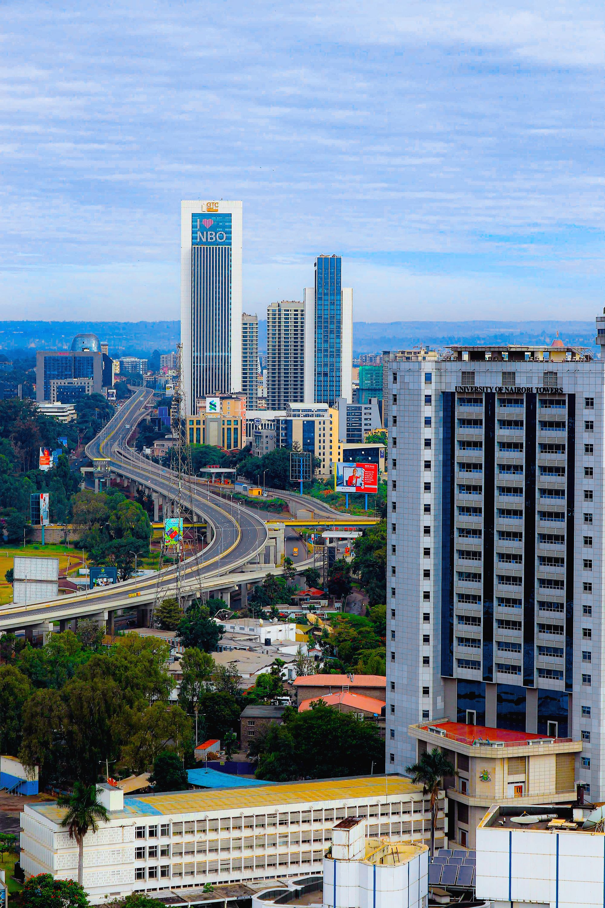 View across a city of low blocks and towers