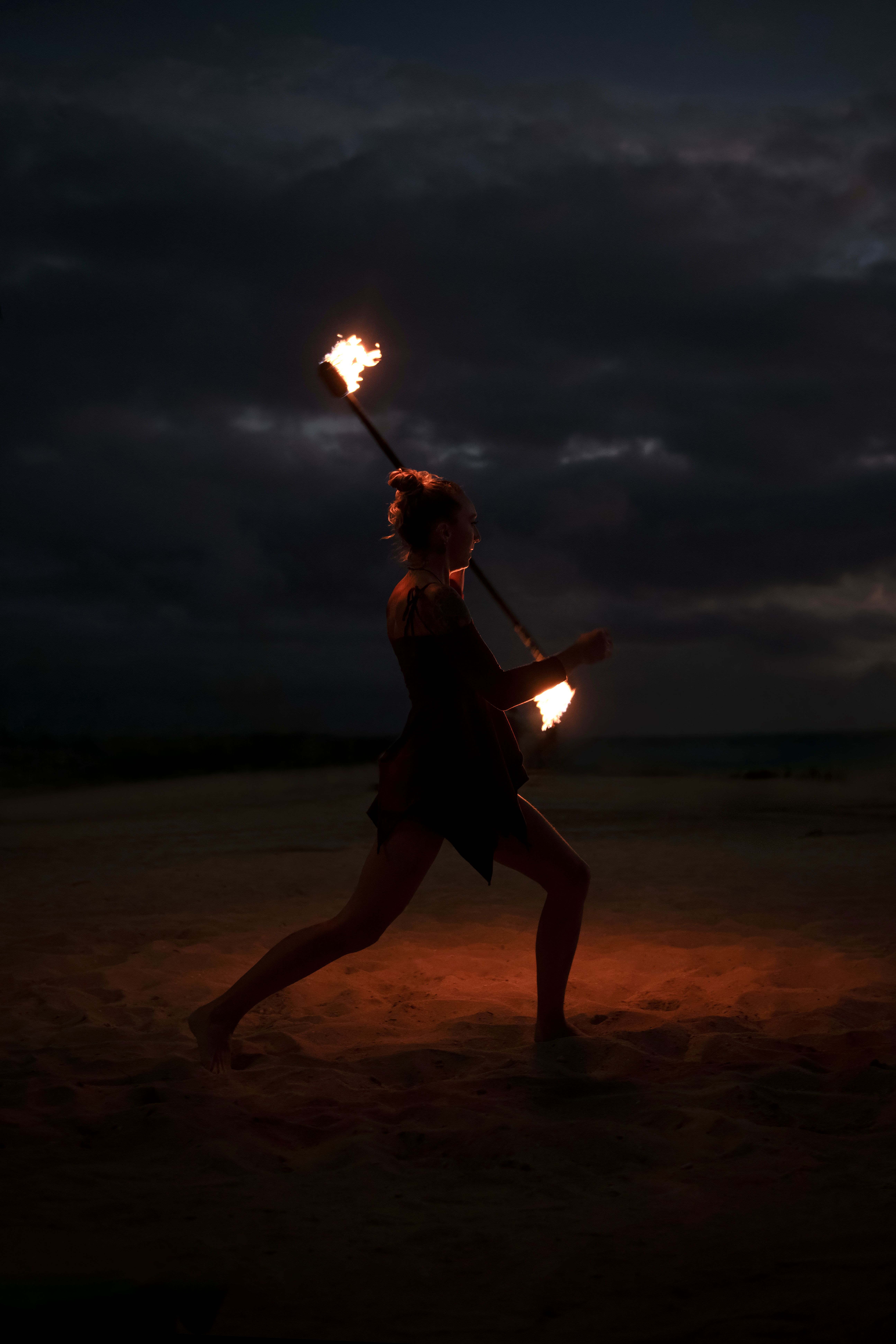 A mesmerizing night fire poi performance on a Honolulu beach.