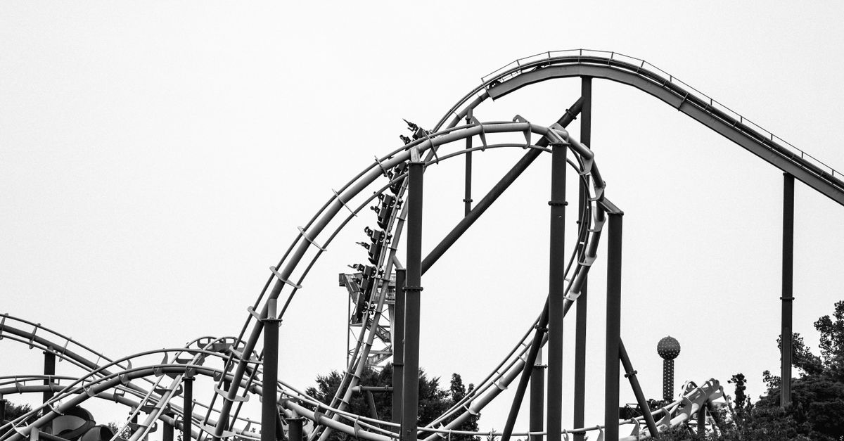 A graph that looks like a roller coaster track, with a tiny person riding it at the top
