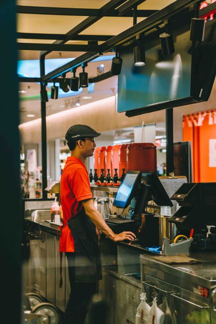 Photo by Theodore Nguyen Young waiter working at a fast food counter in a Kuala Lumpur restaurant.