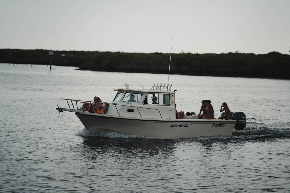Family enjoying a sunny day on a pontoon boat in calm Florida waters - boat insurance quotes florida Family enjoying a sunny day on a pontoon boat in calm Florida waters - boat insurance quotes florida