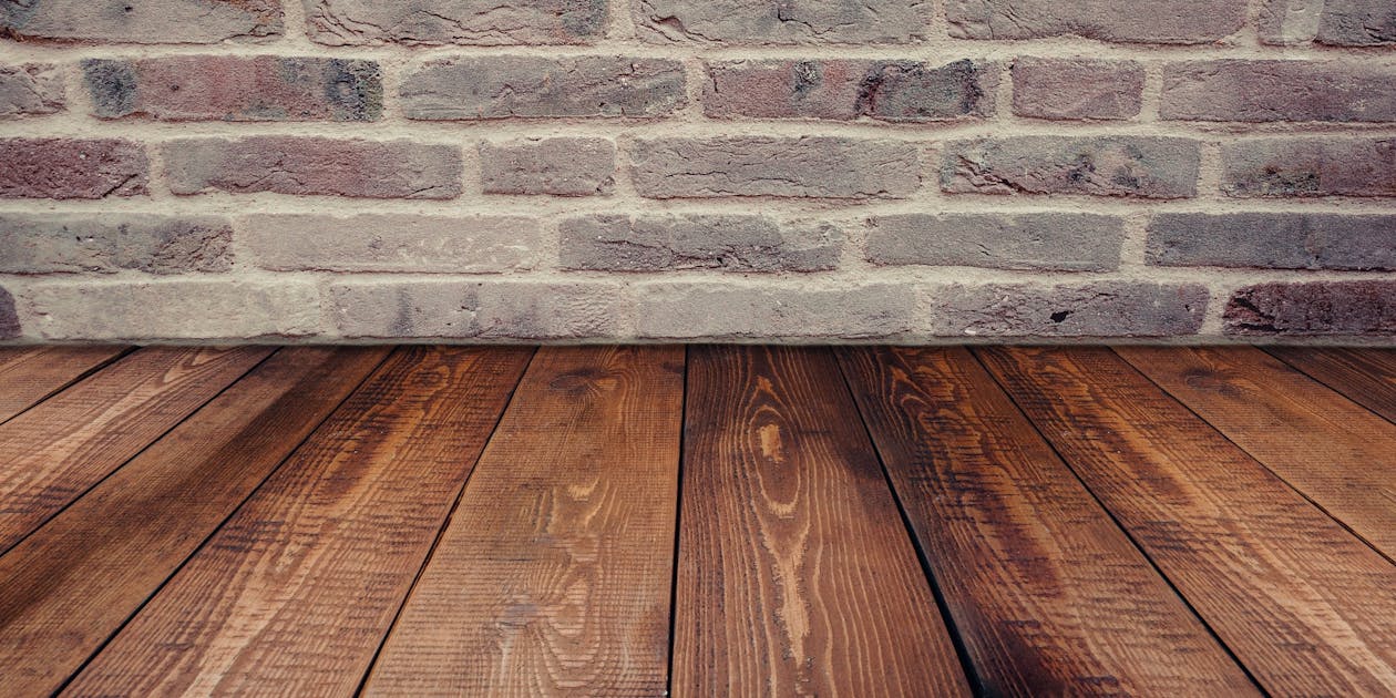 Brown Wooden Panel Beside Concrete Board