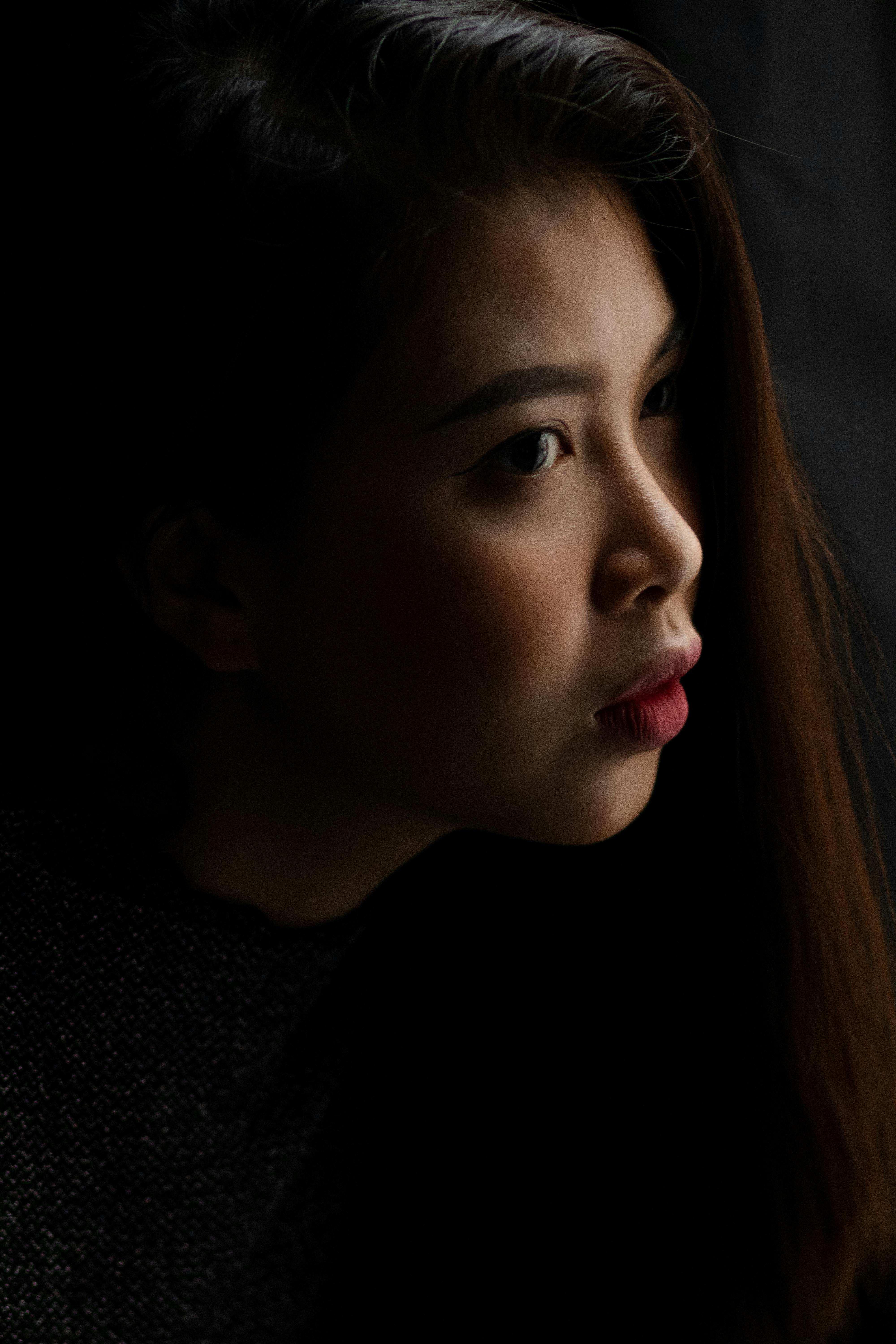 Crowded city street in the evening with people walking close together