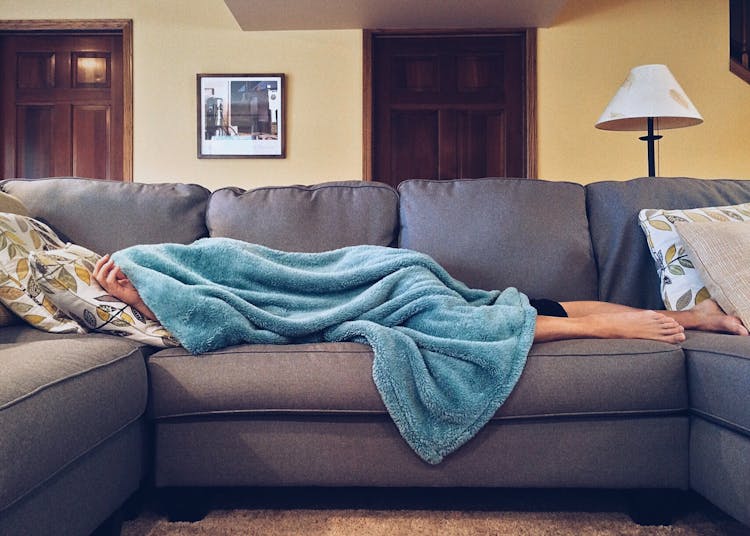 Person Lying On Sofa