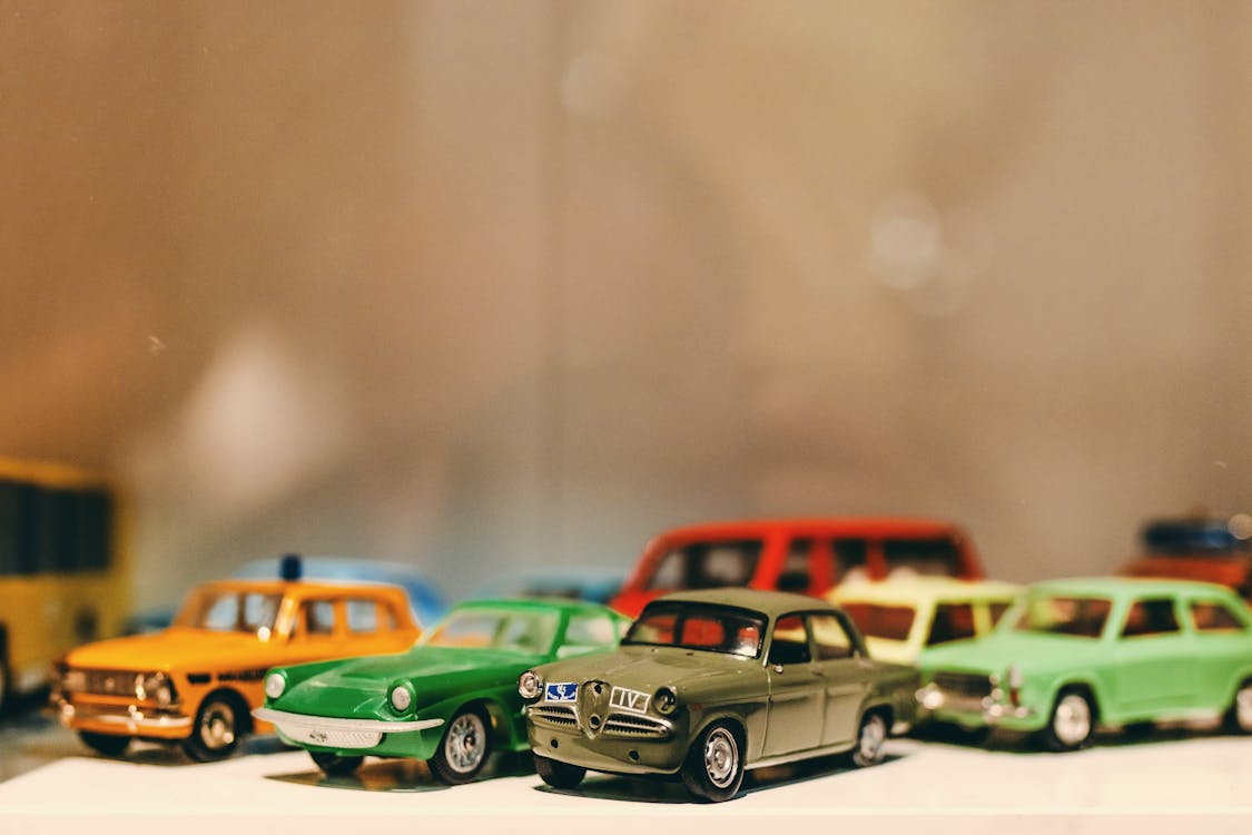 Assorted-color Toy Car Miniatures on White Surface