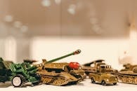 Selective Focus Photography of Die Cast Model Combat Vehicles