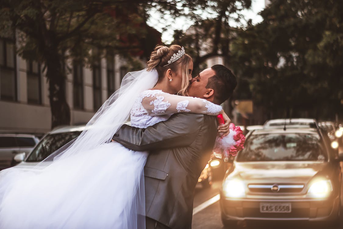 Free Groom and Bridge Kissing Each Other  Stock Photo