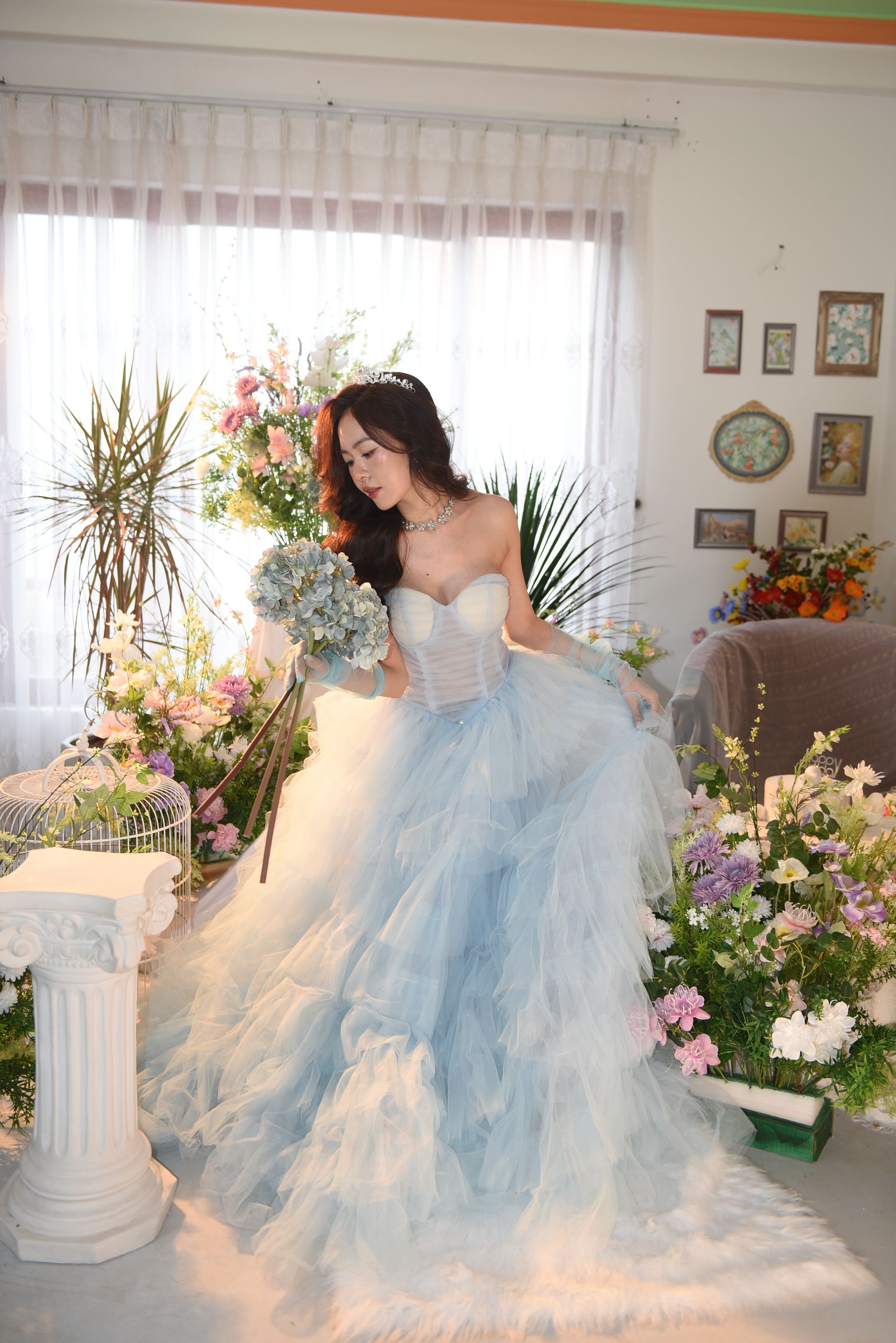 Woman in Blue Dress Standing Looking at Flower Bouquet · Free Stock Photo