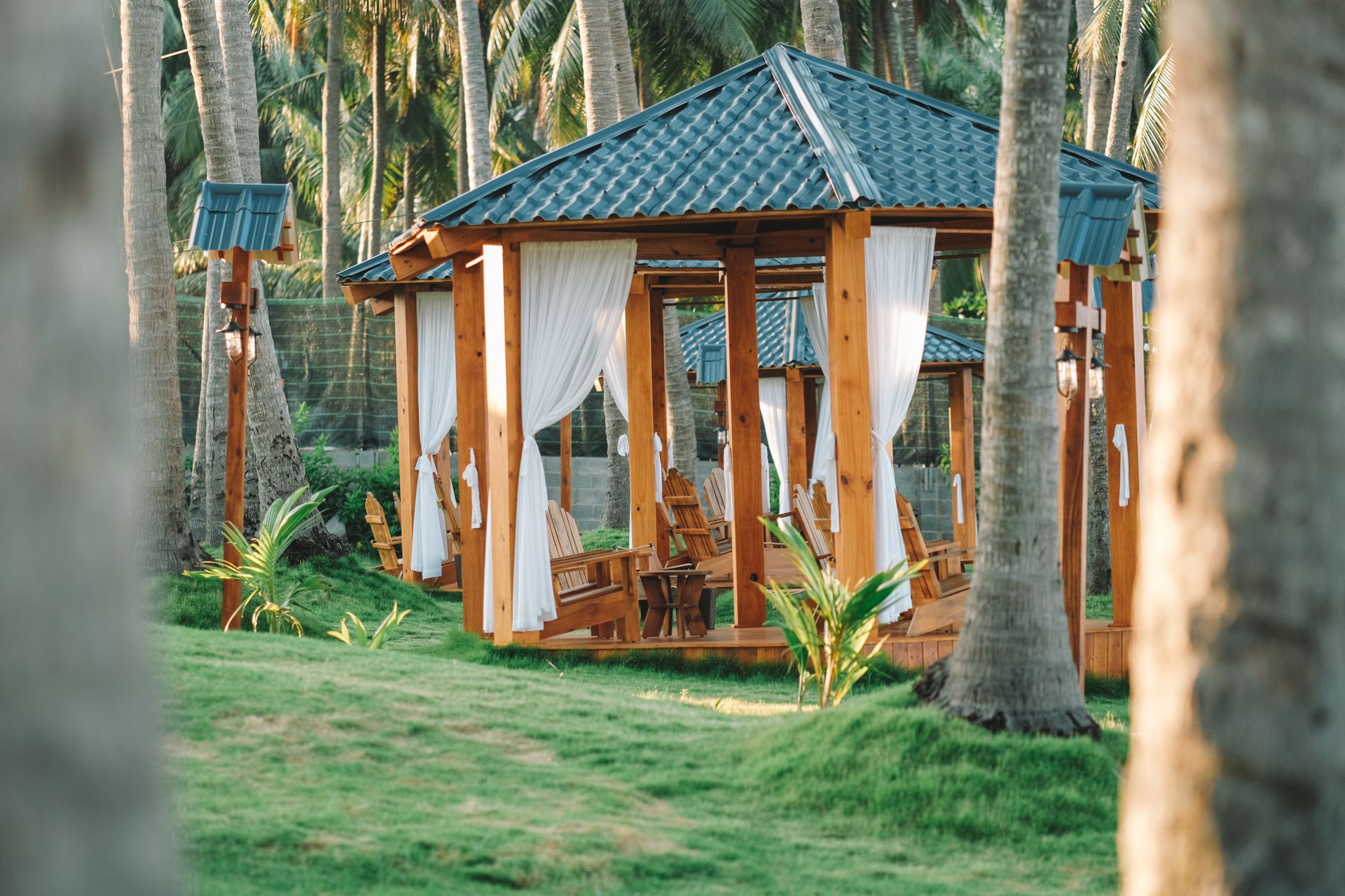 Wooden Gazebos surrounded by Palm Trees