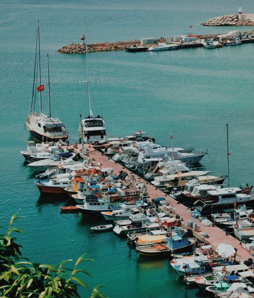 Free A picturesque view of boats moored at a marina, photographed from above during sunset. Stock Photo