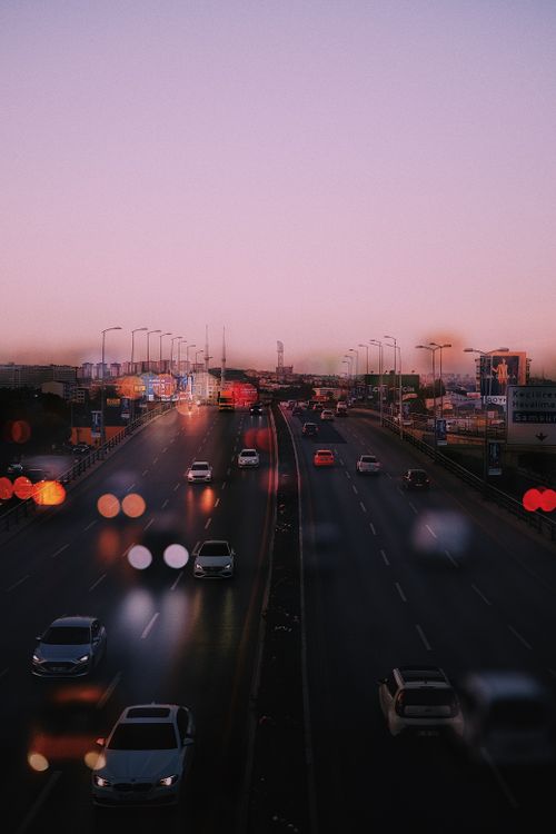 Free A vibrant view of Ankara's highway at dusk with colorful city lights and traffic. Stock Photo