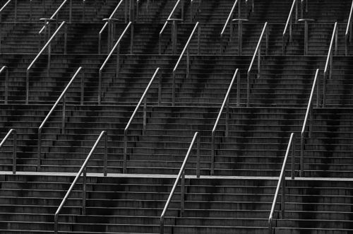 Free Black and white abstract photo of a repetitive staircase pattern in Stockholm. Stock Photo