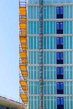 High-rise building facade with scaffolding in Oslo, Norway, showcasing modern architecture.