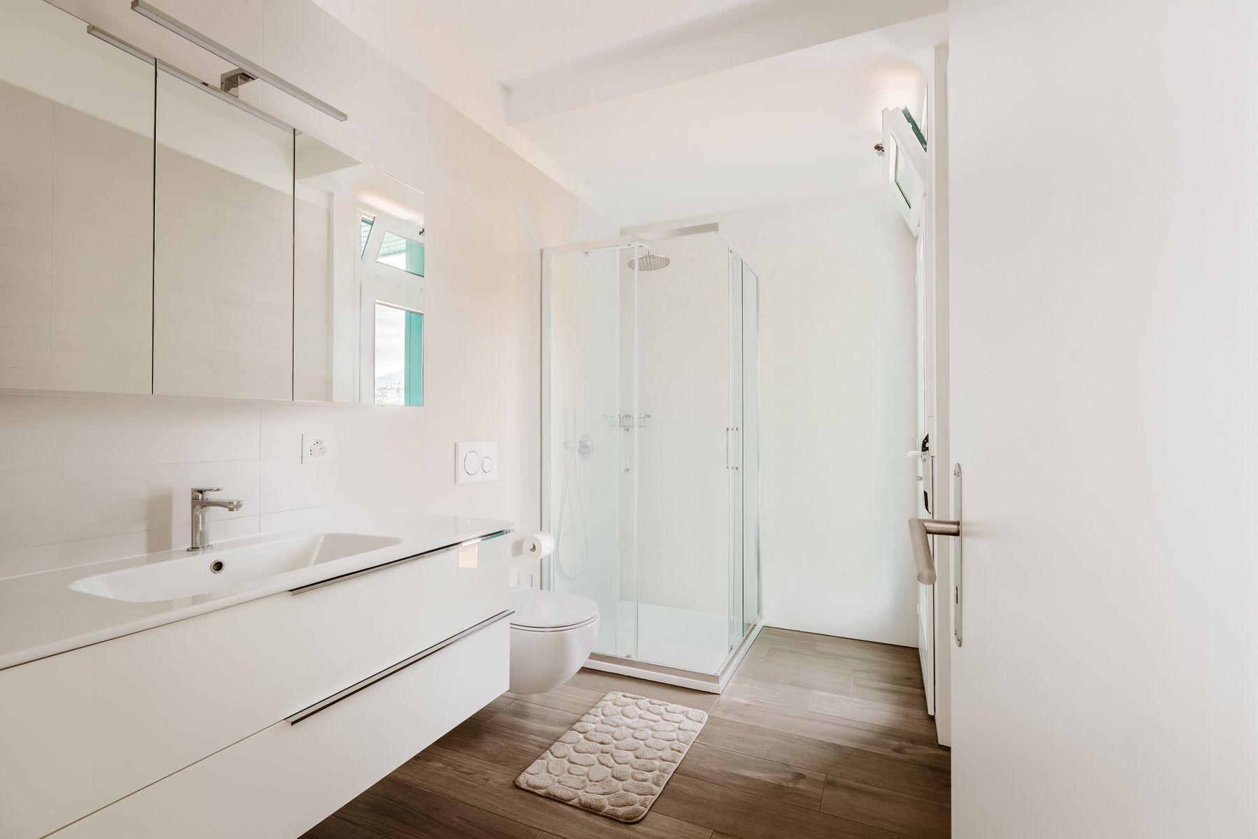 Bright contemporary interior with clean fixed surfaces and changeable mirrors, lighting and accessories
