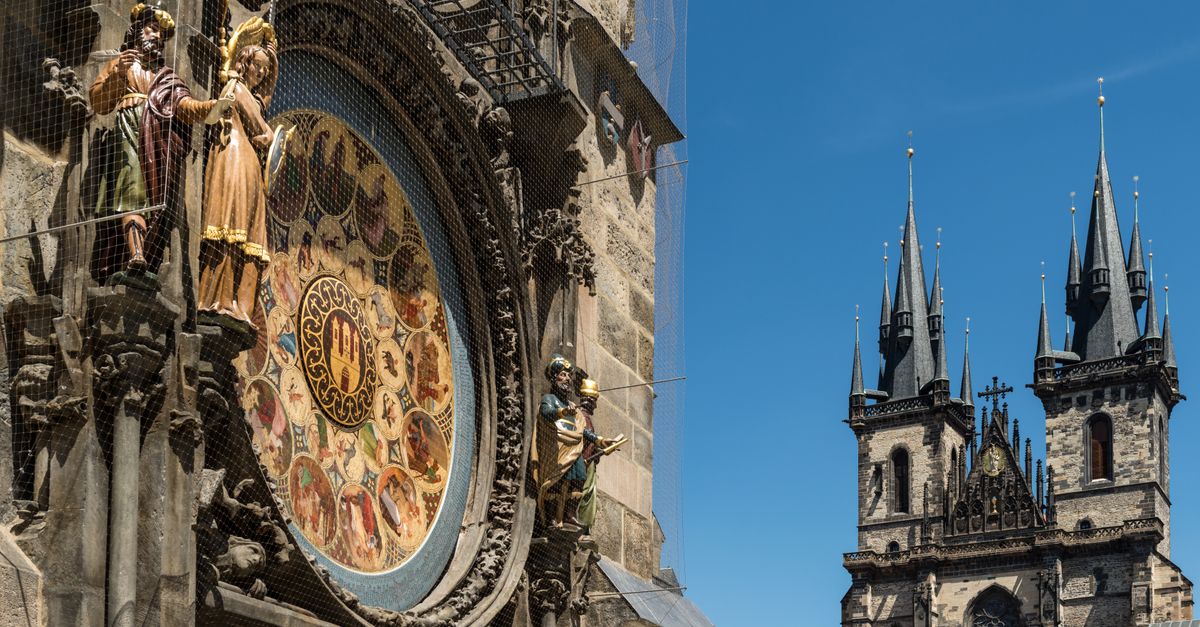 Prague Old Town Square with Astronomical Clock tower and Gothic Tyn Church at sunset