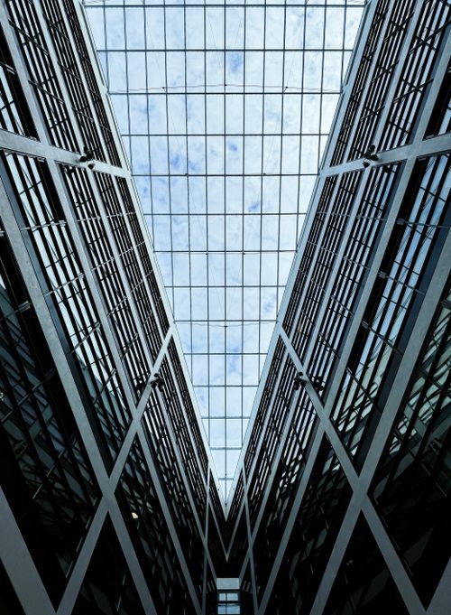 Free Dramatic low-angle shot of modern glass architecture in Berlin, Germany. Stock Photo