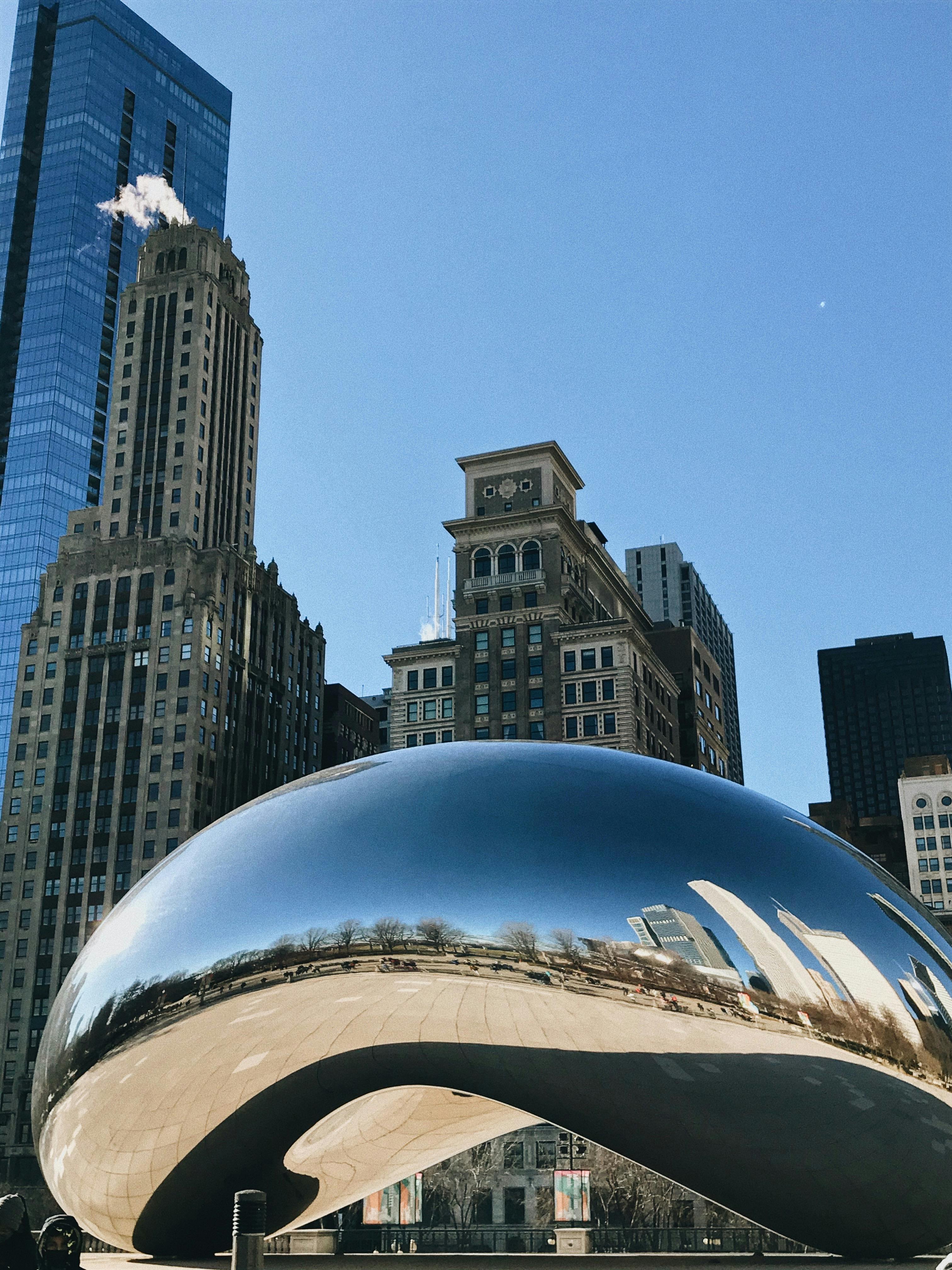 Stunning view of the Cloud Gate sculpture reflecting Chicago's skyline.