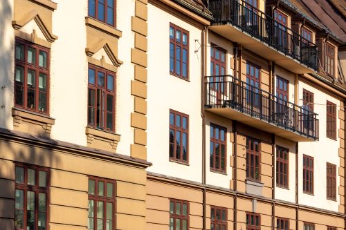 Free Traditional building facade in Oslo with multiple balconies and windows in sunlight. Stock Photo