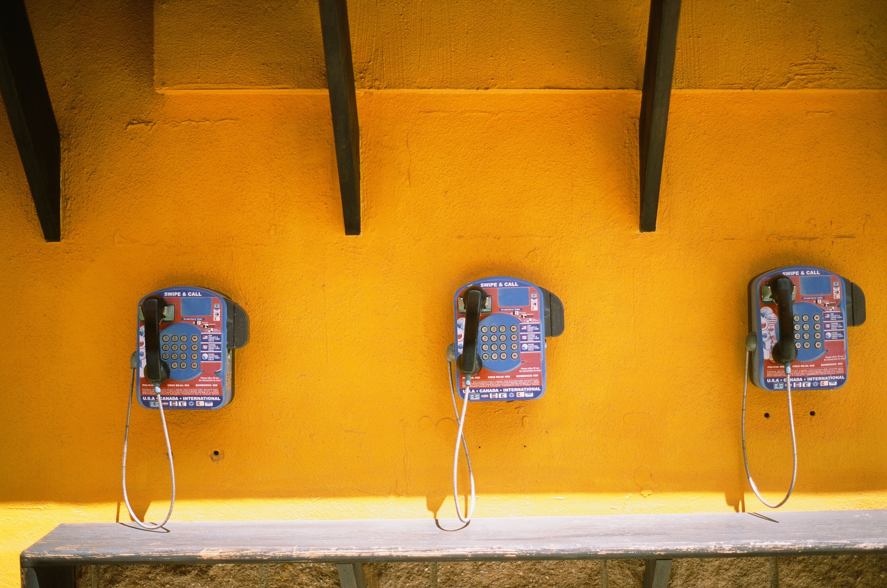 Three Blue-and-black Telephones