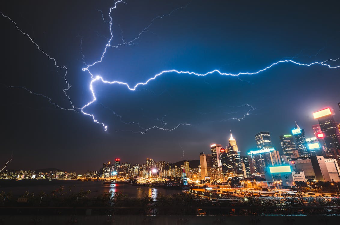 Photo of City Buildings Under Lightning Strike