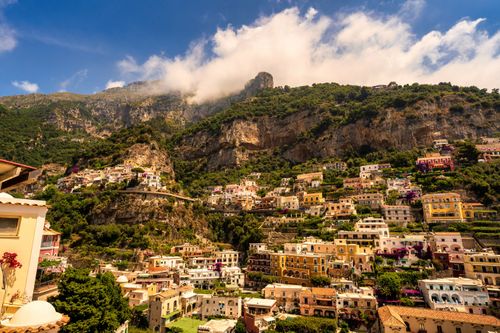 Free Charming coastal town of Positano, Italy, nestled on a cliff with colorful buildings. Stock Photo