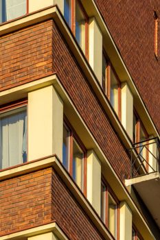 Close-up of a contemporary brick apartment facade in Oslo, showcasing sleek urban design.