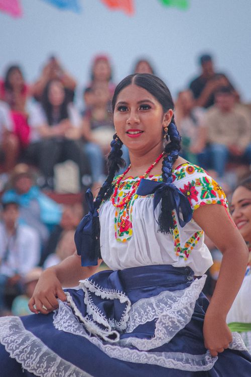 Free A colorful display of traditional Mexican dance during a festival in Oaxaca. Stock Photo
