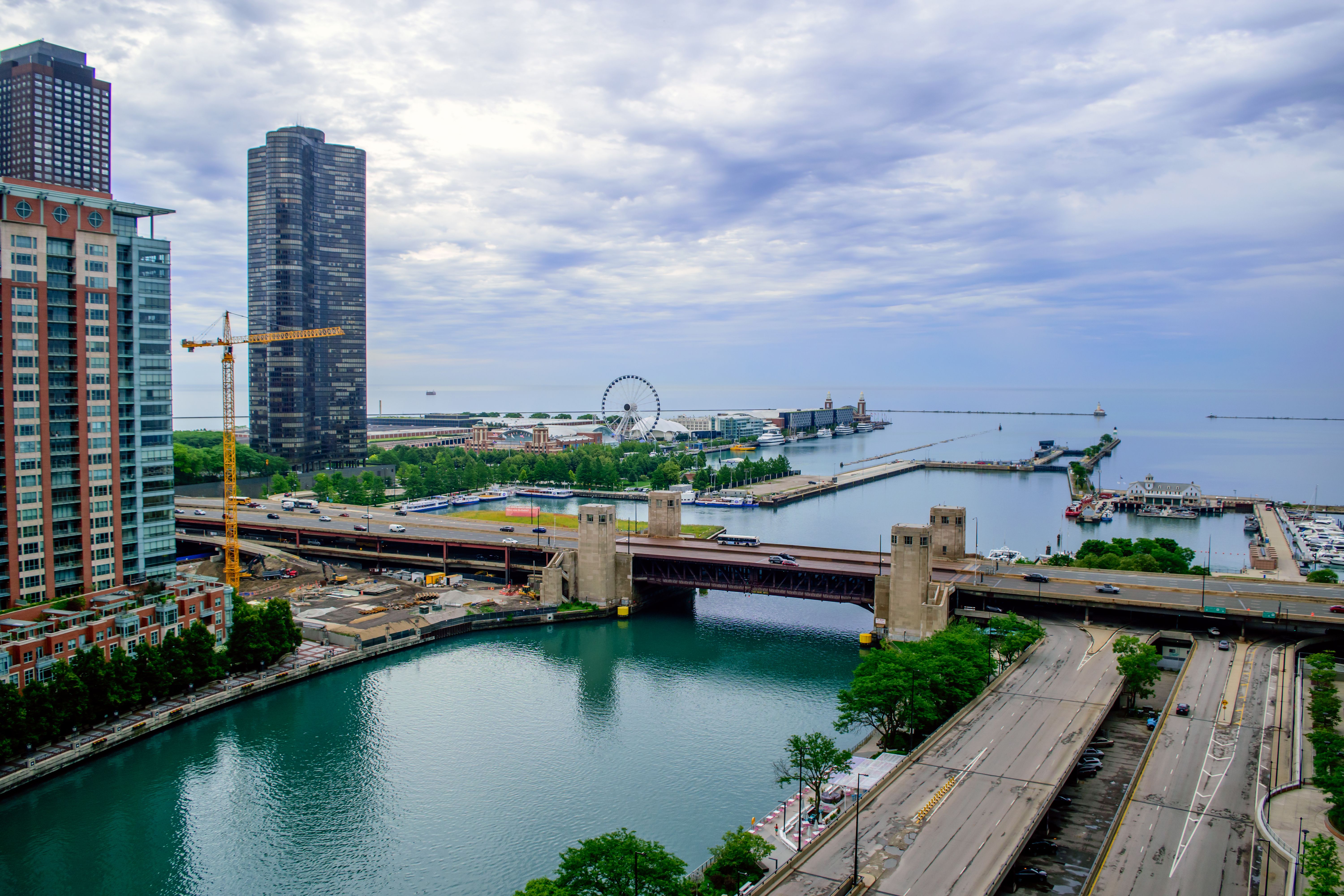 A view of a city with a river and buildings · Free Stock Photo