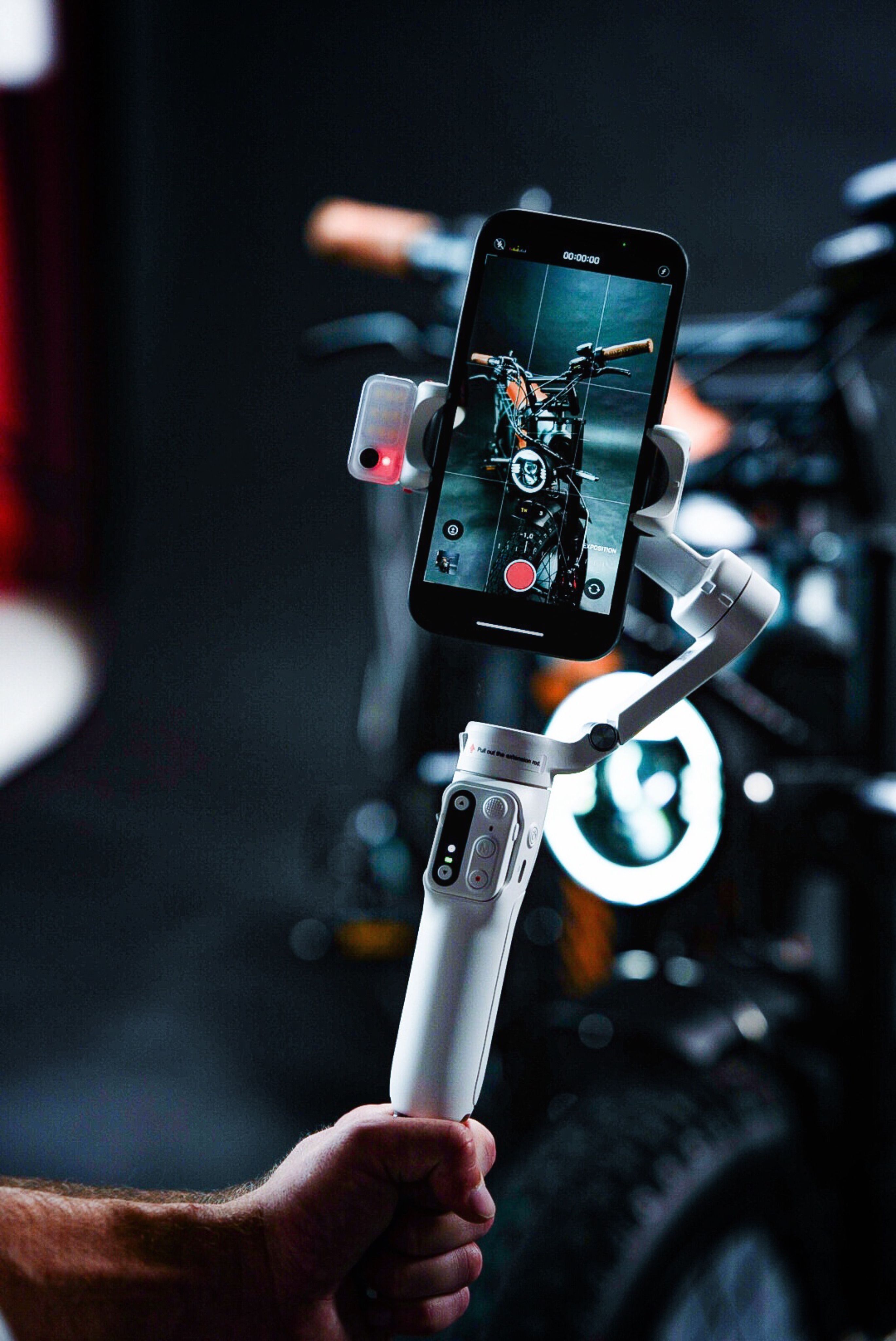 Videographer recording with a smartphone on a stabiliser