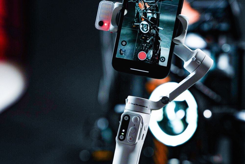 Videographer filming an event on a stabilised camera