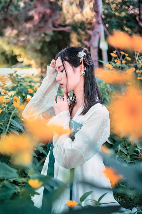 Free Photo Of Woman Standing Near Plants Stock Photo