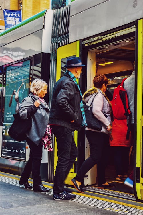 Free stock photo of city photography, melbourne, people boarding tram