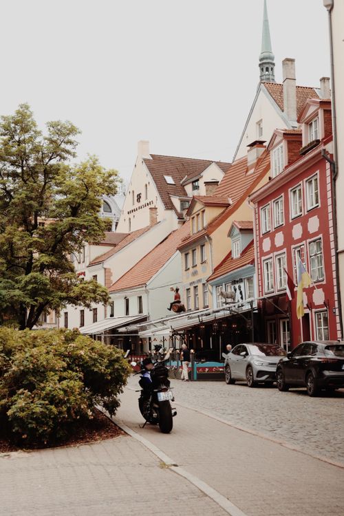 Free Explore the vibrant and historic streets of Riga, Latvia, featuring colorful architecture and a peaceful urban scene. Stock Photo
