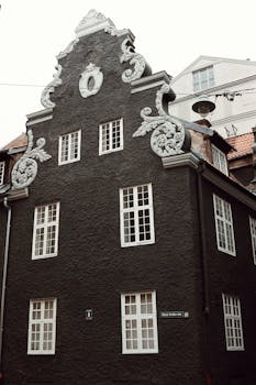 Detailed facade of Gothic building in Riga's old town, featuring ornate architectural elements.