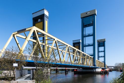 Free Image of Kattwyk Bridge in Hamburg, Germany, showcasing its industrial design and sunny atmosphere. Stock Photo