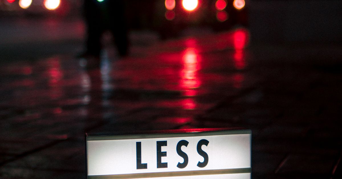 Nothing Less Sign Less 1$ More Signage on Sidewalk · Free Stock Photo