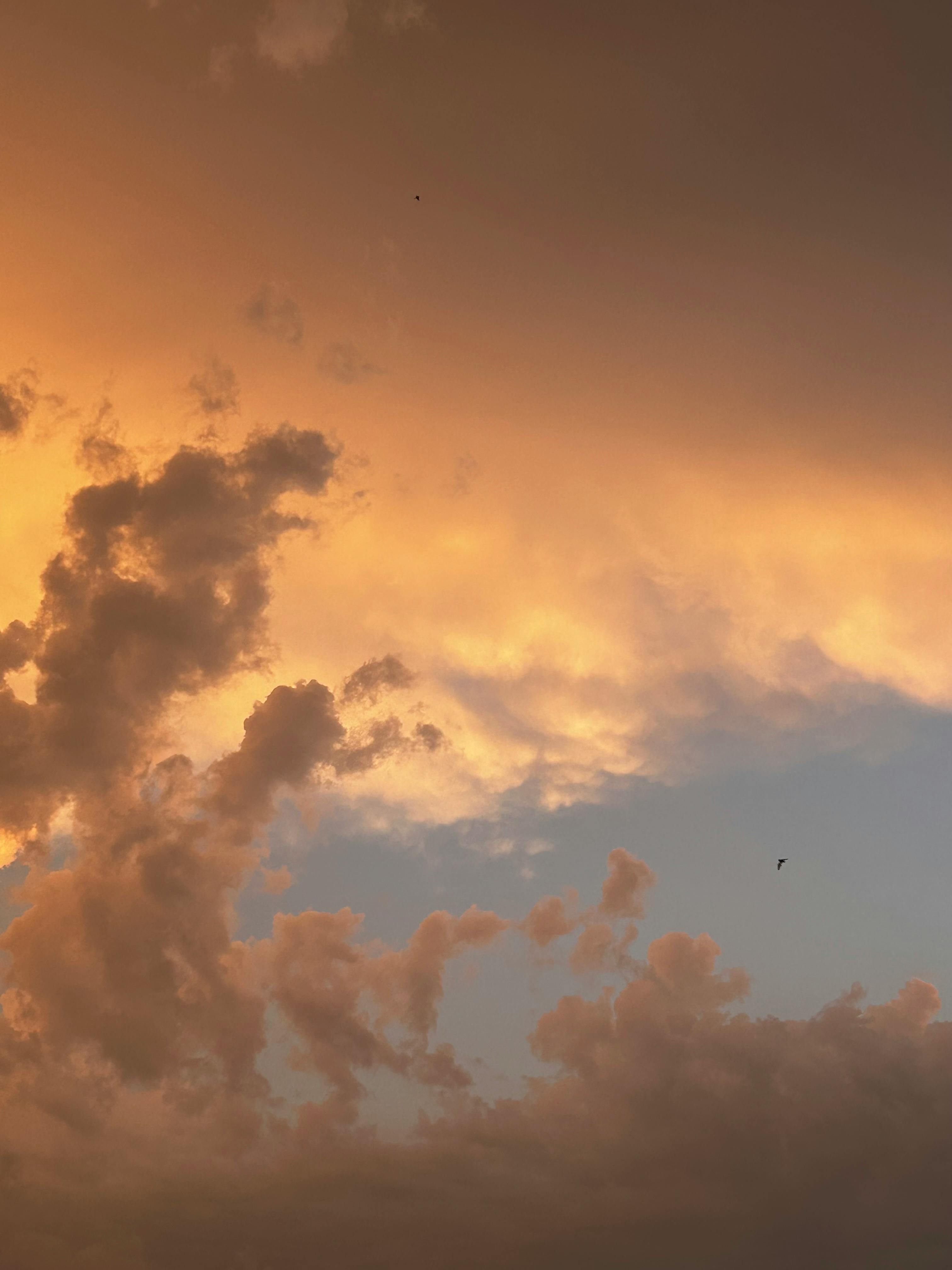 Beautiful cloudscape at sunset showcasing dramatic orange and blue sky.
