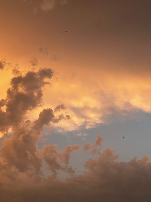 Beautiful cloudscape at sunset showcasing dramatic orange and blue sky.