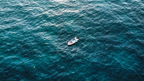 People Riding a Boat on a Body of Water · Free Stock Photo