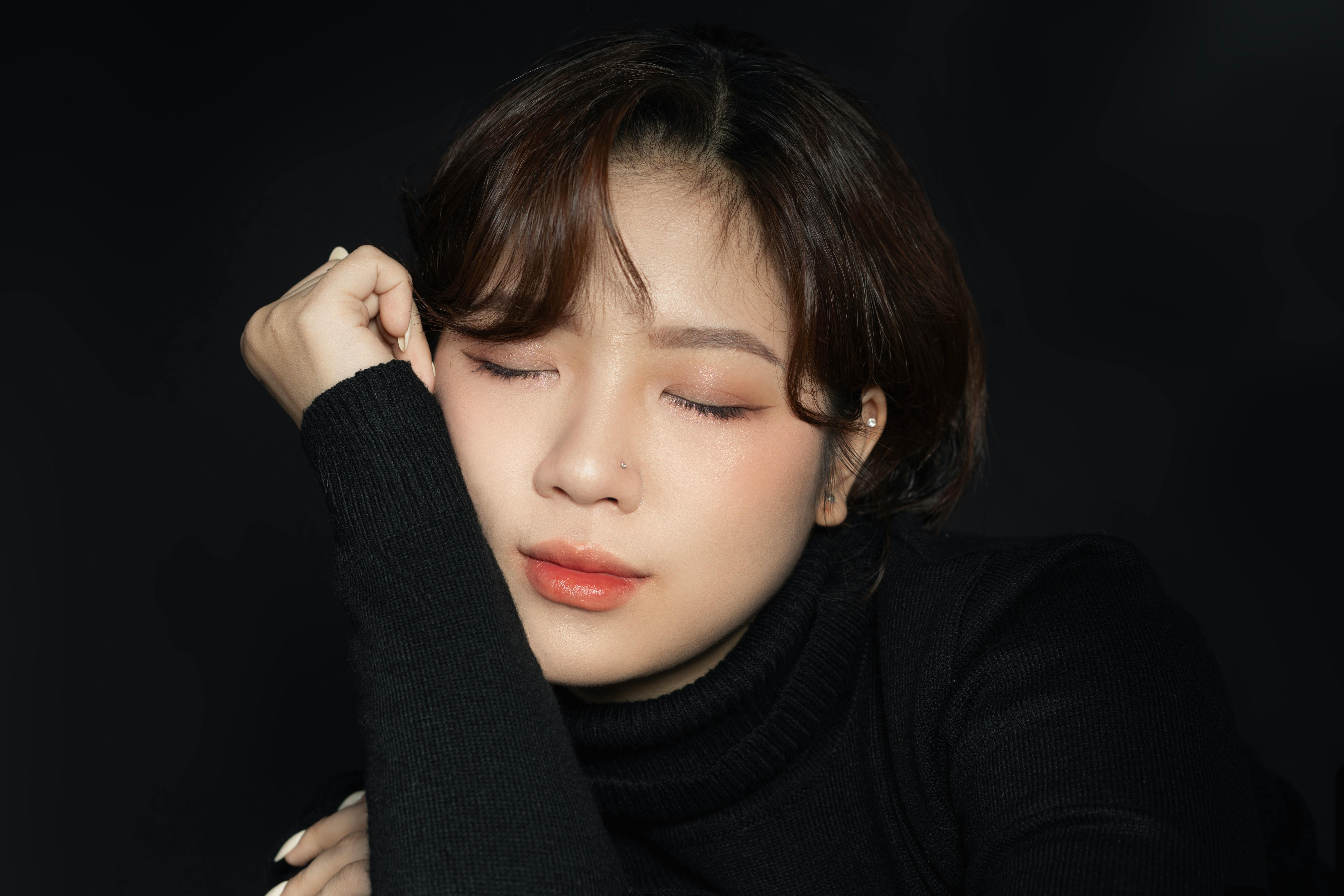 Free Brunette with Eyes Closed Wearing Turtleneck Stock Photo