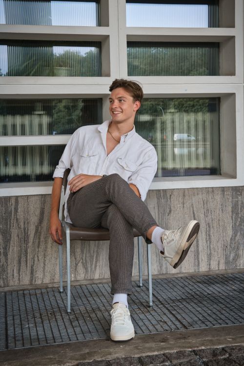 Free Stylish young man posing in Berlin, showcasing urban fashion in a modern setting. Stock Photo