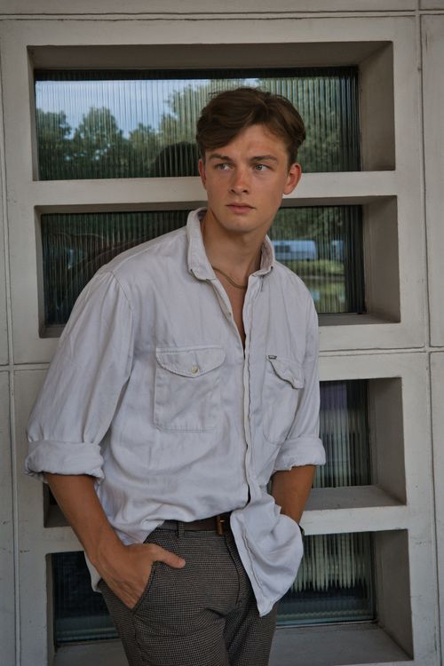 Free Young man in casual fashion posing confidently outdoors in Berlin. Stylish and modern. Stock Photo