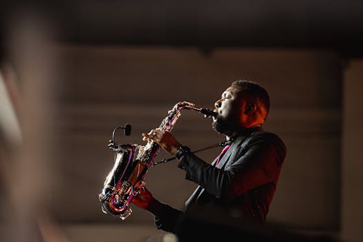A talented saxophonist passionately plays during a live concert indoors.