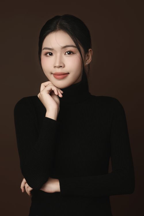 Free Chic and elegant studio portrait of a smiling woman in a black turtleneck, exuding confidence and grace. Stock Photo