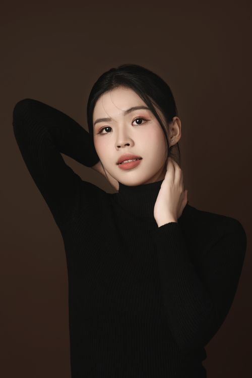 Free Sophisticated portrait of an Asian woman posing in a studio in Ho Chi Minh City, Vietnam. Stock Photo