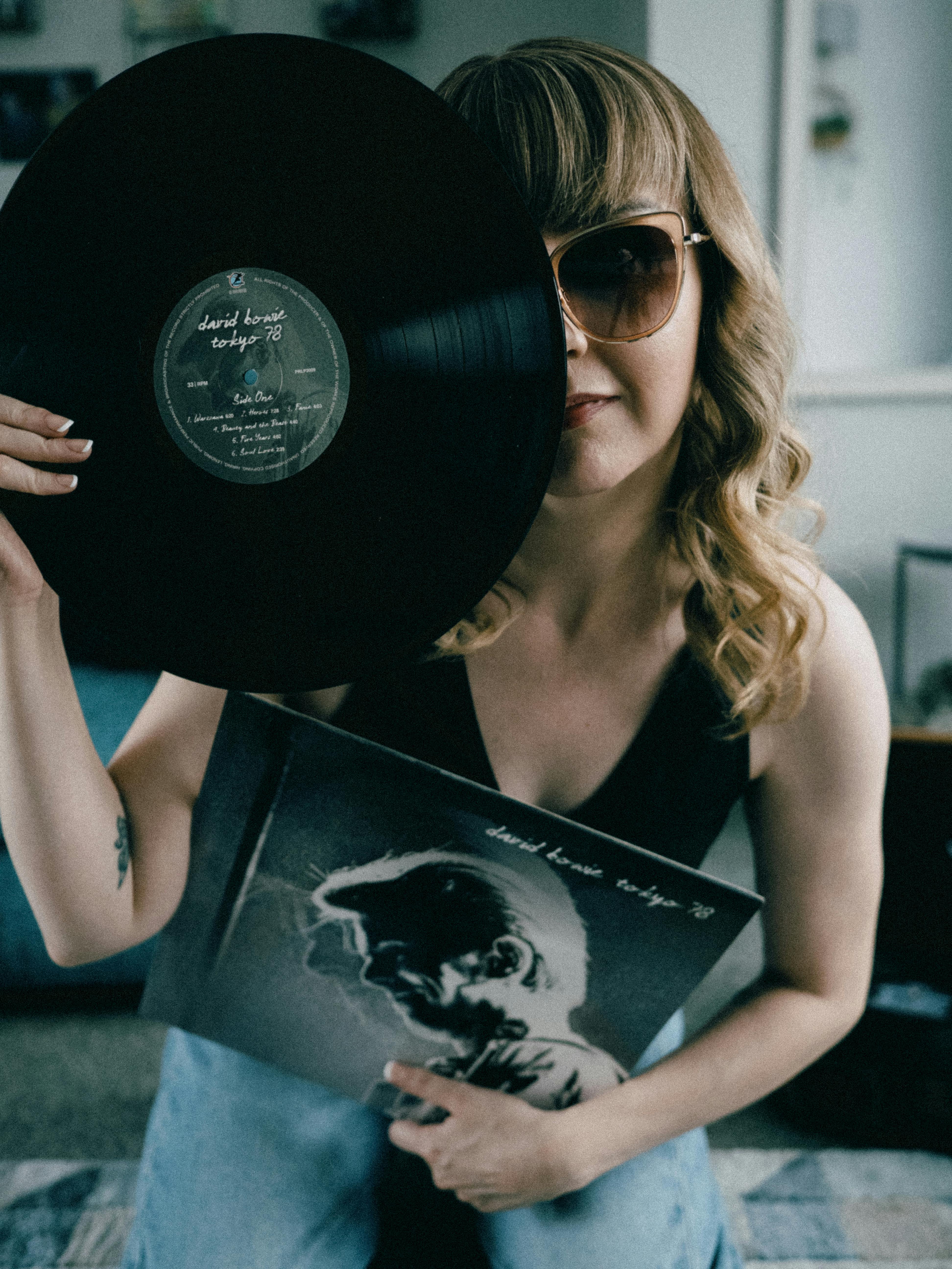portrait of woman with vinyl disk
