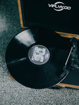 Close-up of a vintage vinyl record spinning on a turntable, evoking nostalgia.
