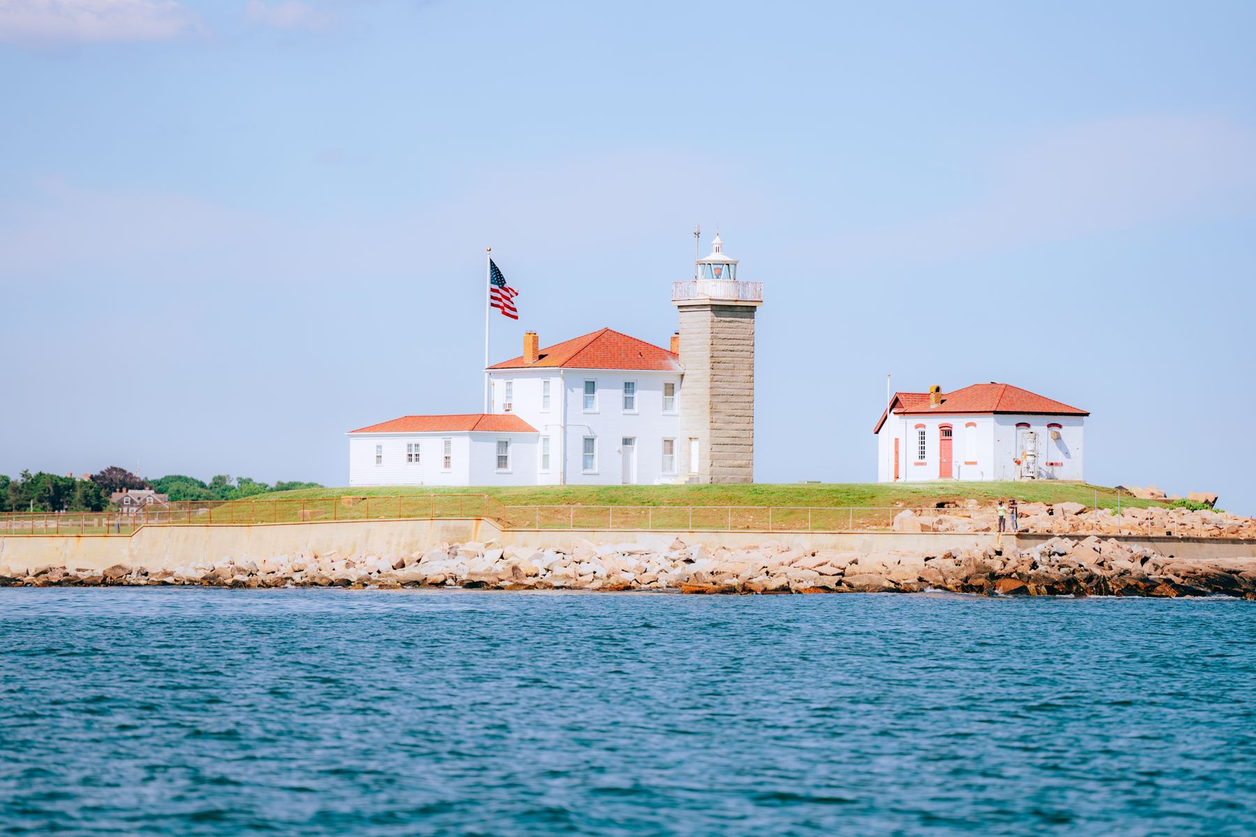 A lighthouse station on a point in clear light